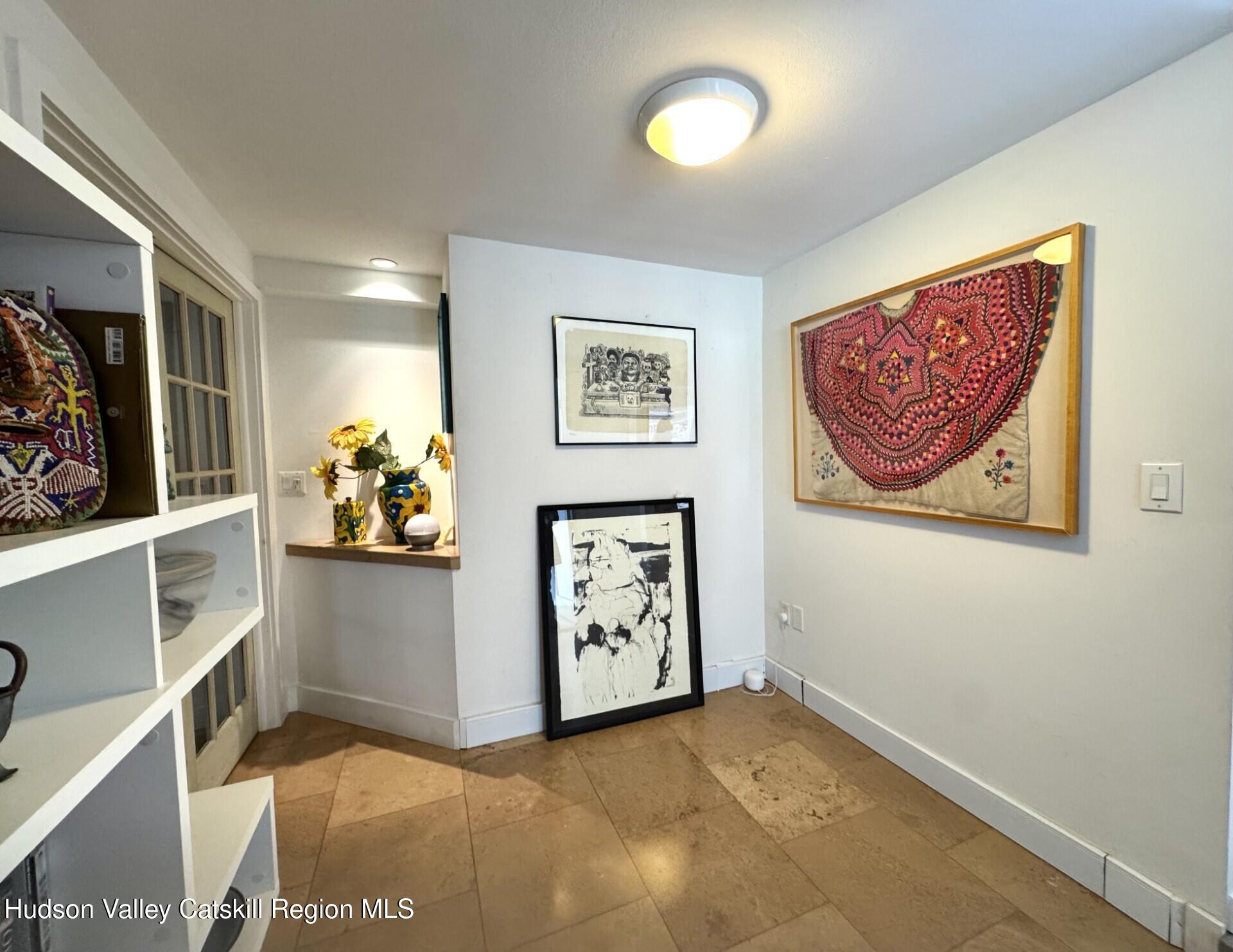 115 Jones Quarry Road Woodstock, NY 12498 - Photo 30 of 38 a view of a hallway with painting on the wall