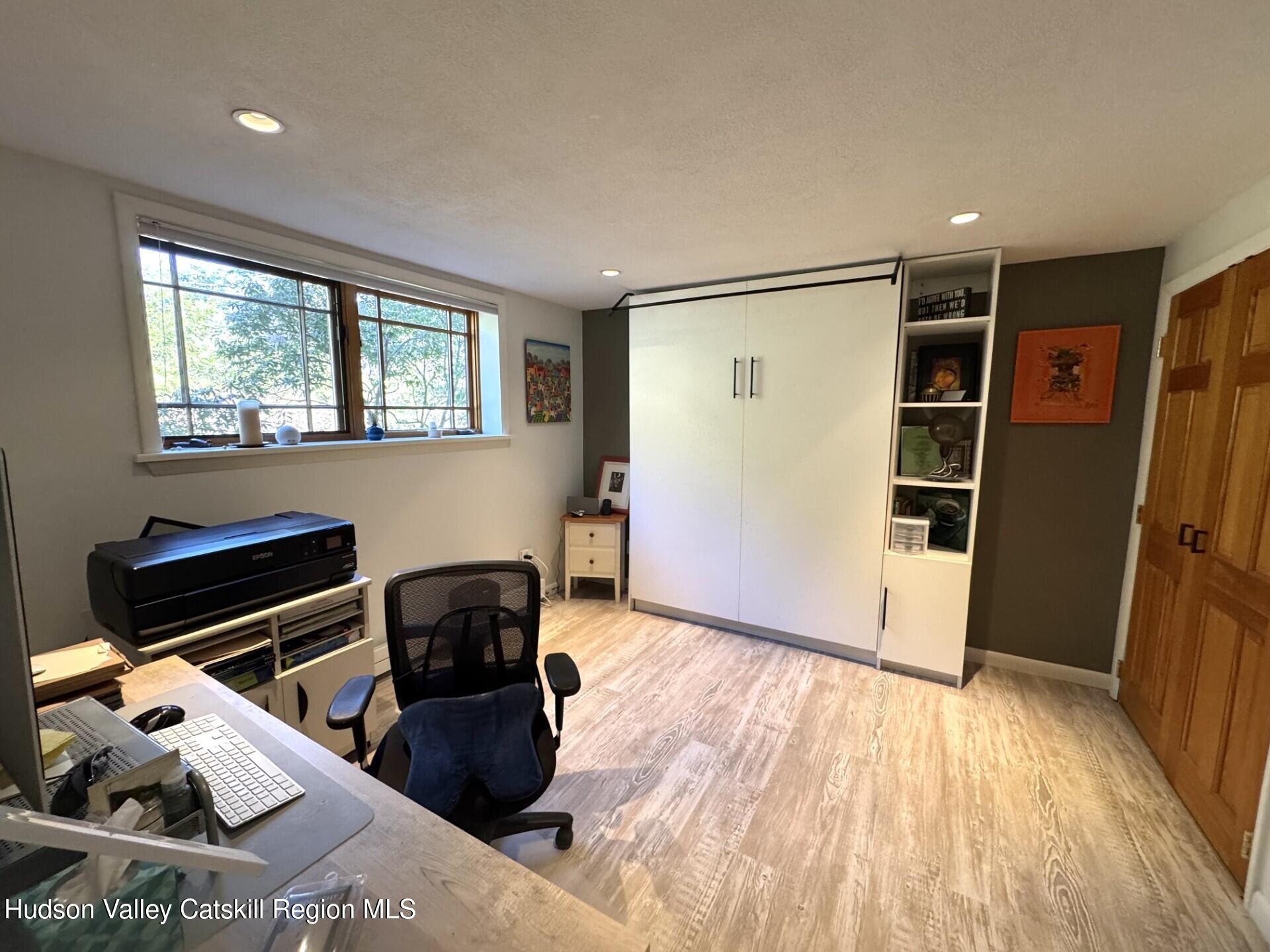 115 Jones Quarry Road Woodstock, NY 12498 - Photo 31 of 38 a hallway with furniture and wooden floor