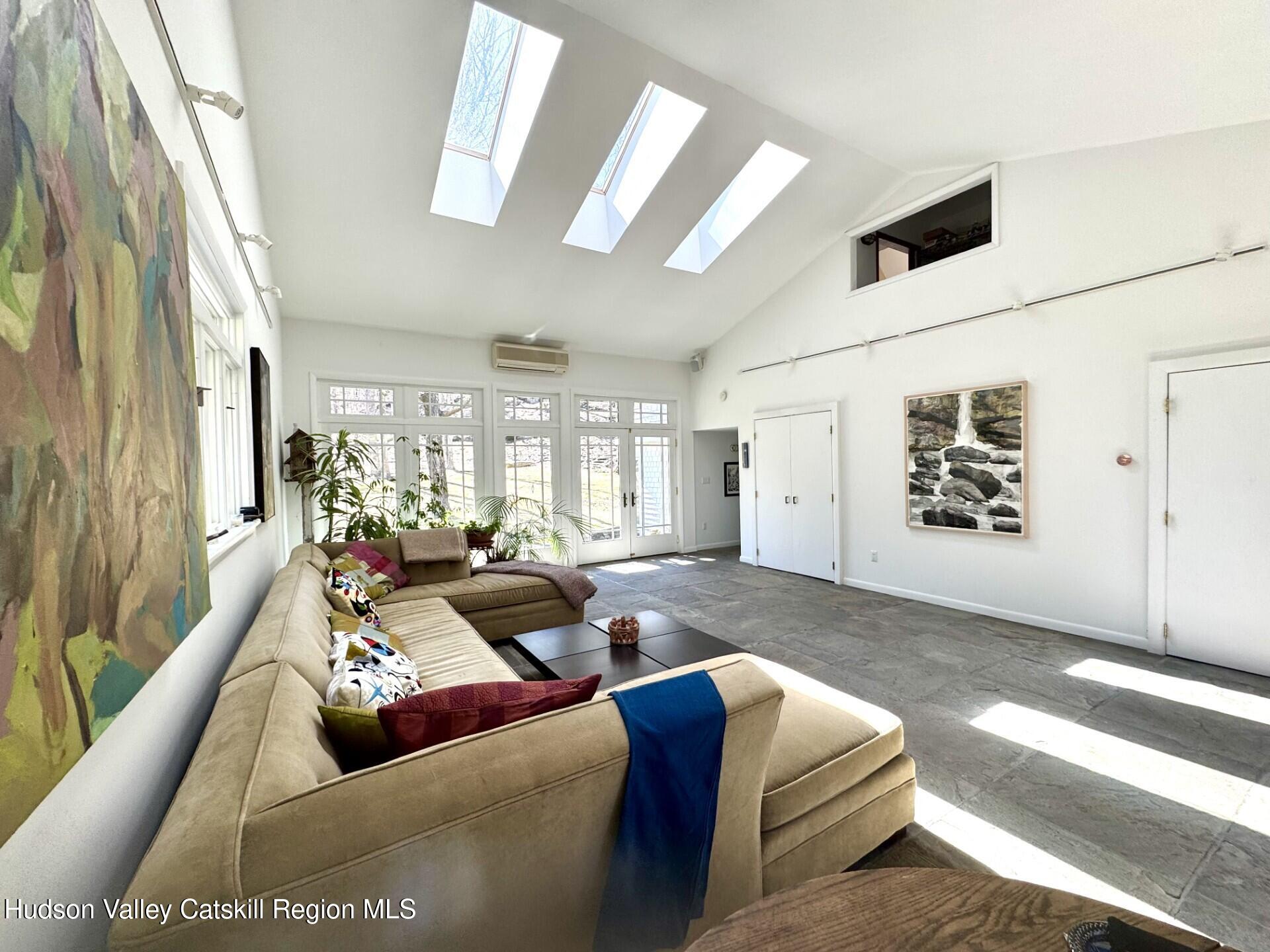 115 Jones Quarry Road Woodstock, NY 12498 - Photo 10 of 38 a living room with furniture and a large window