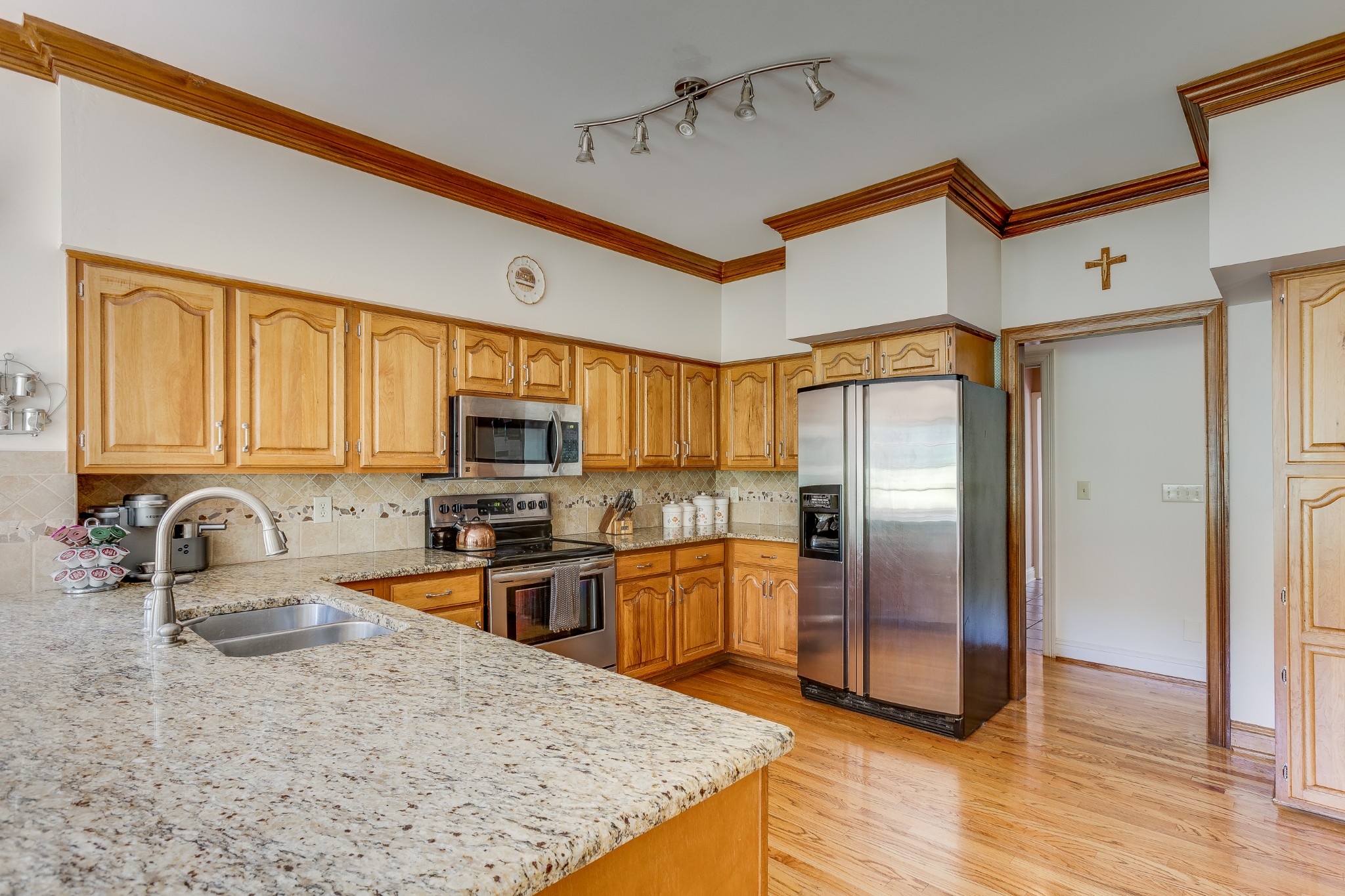 1111 Temple Ridge Court Nashville, TN 37221 - Photo 17 of 46 a kitchen with stainless steel appliances granite countertop a sink a stove and refrigerator