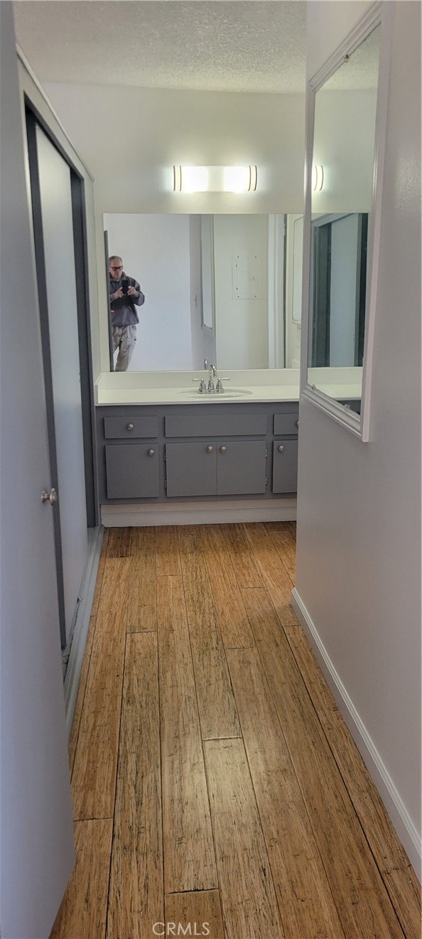 4370 West 141st Street Hawthorne, CA 90250 - Photo 4 of 7 a bathroom with a sink mirror vanity and toilet