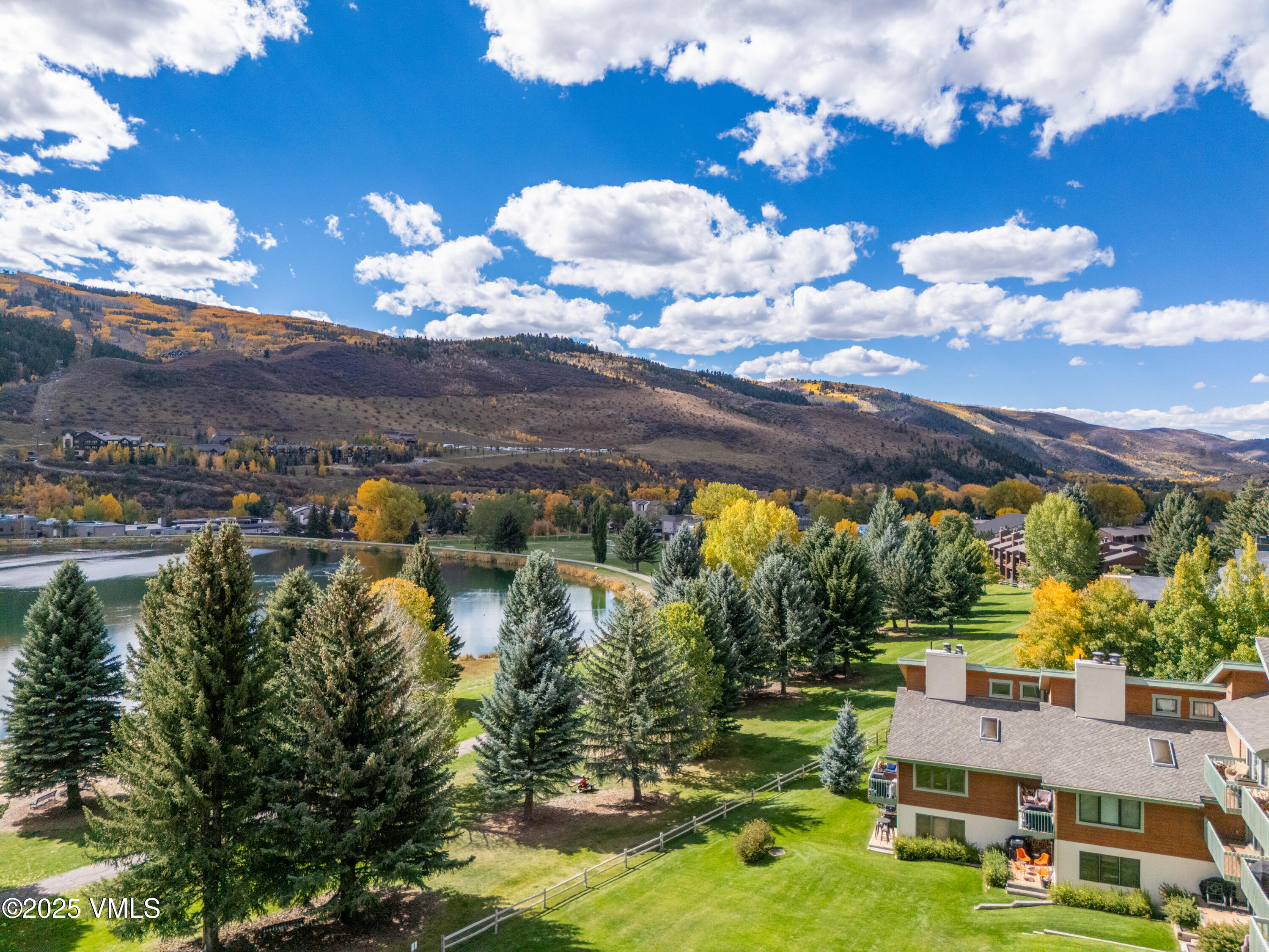 520 West Beaver Creek Boulevard, Unit A103 Avon, CO 81620 - Photo 17 of 21 a view of a swimming pool with seating area and mountain view