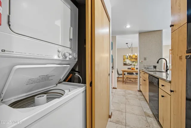 a kitchen with granite countertop a sink and cabinets