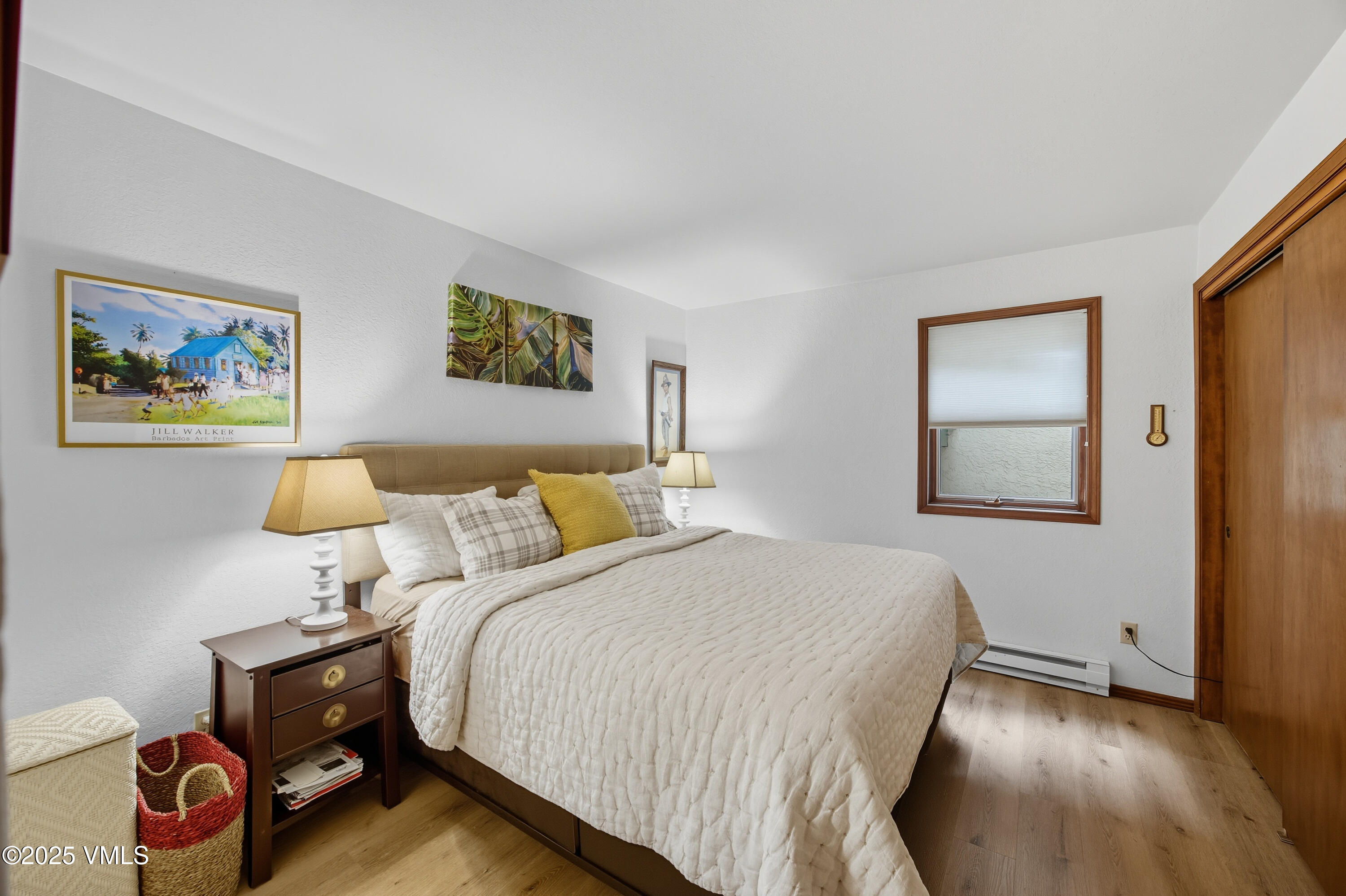 520 West Beaver Creek Boulevard, Unit A103 Avon, CO 81620 - Photo 8 of 21 a bedroom with a bed and a lamp on dresser