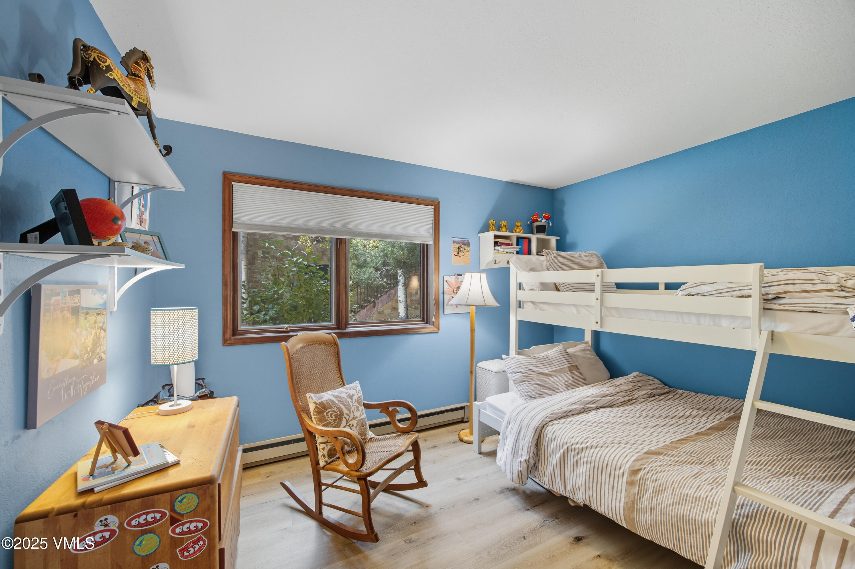 520 West Beaver Creek Boulevard, Unit A103 Avon, CO 81620 - Photo 10 of 21 a bedroom with a bed and a window