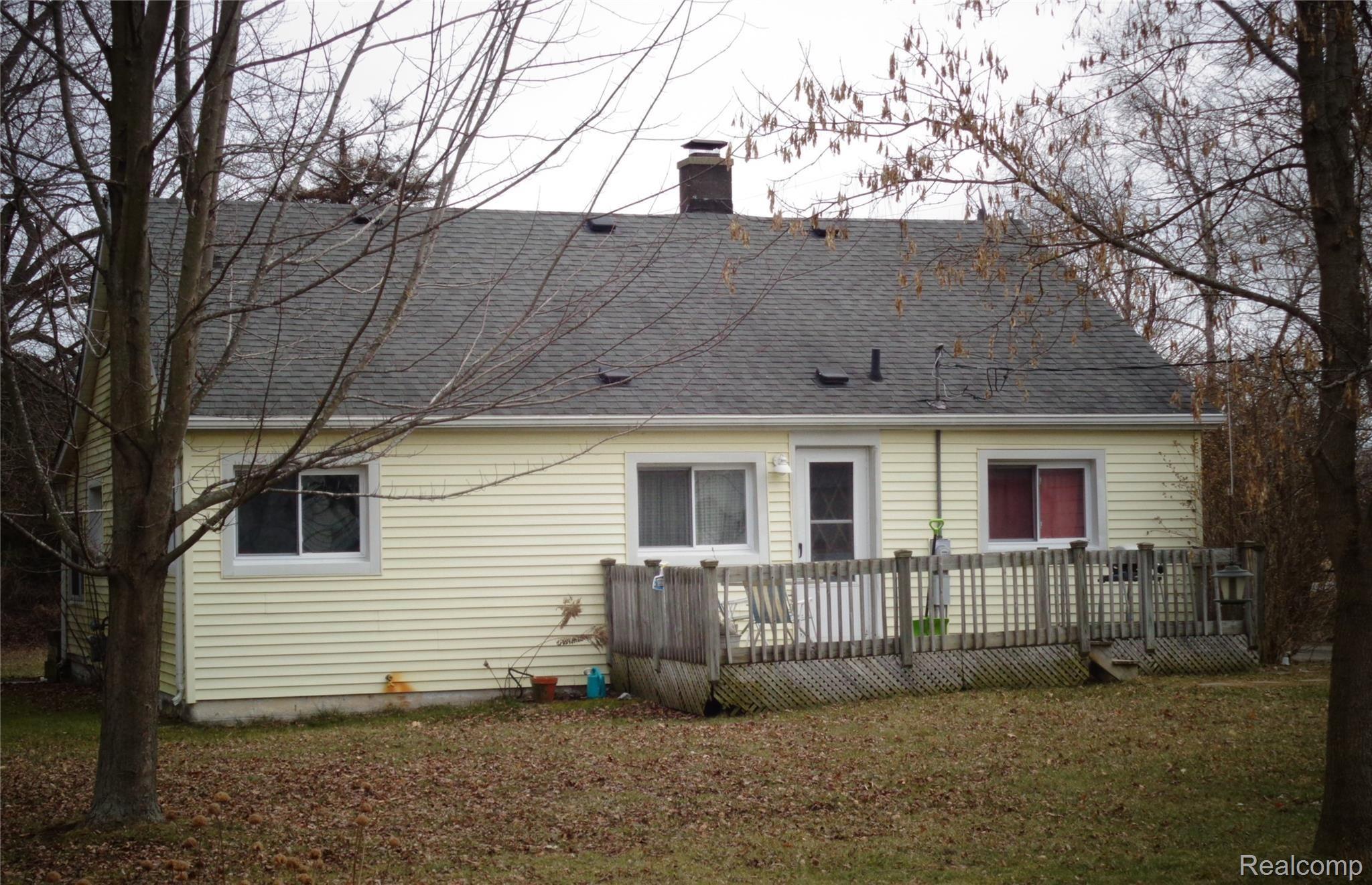 5910 Lakeshore Road Lexington, MI 48450 - Photo 2 of 12 5910 home rear.JPG