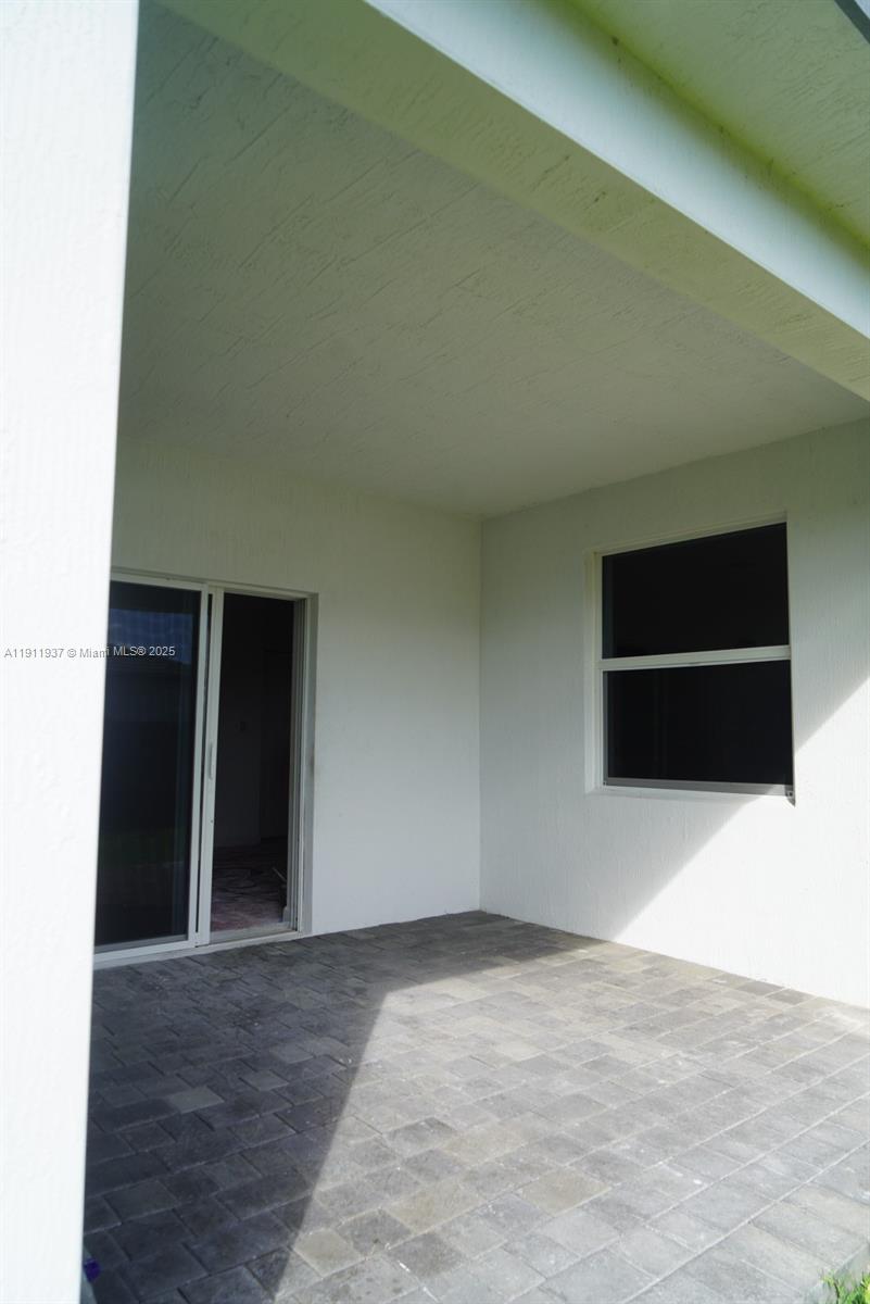 16910 Southwest 288th Street Homestead, FL 33030 - Photo 12 of 15 a view of an empty room with a window