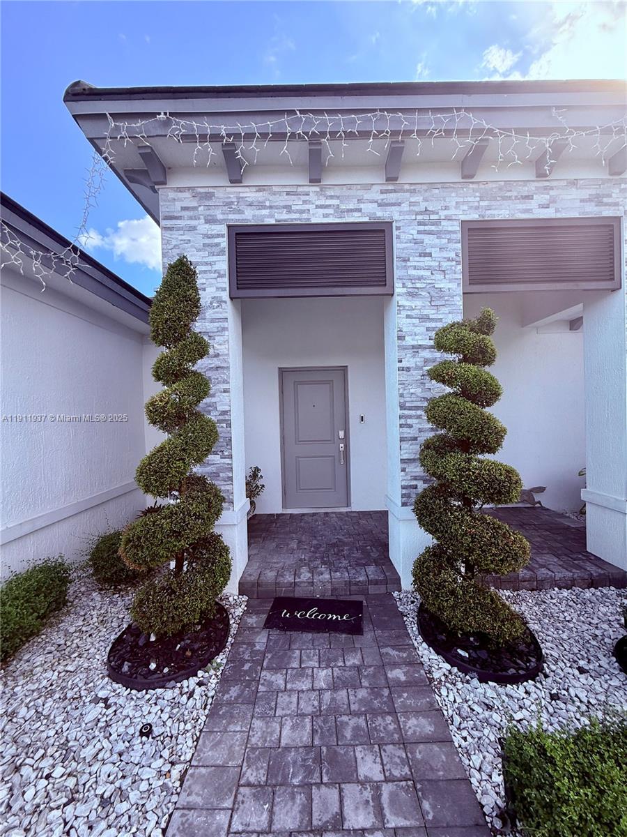 16910 Southwest 288th Street Homestead, FL 33030 - Photo 2 of 15 a front view of a house