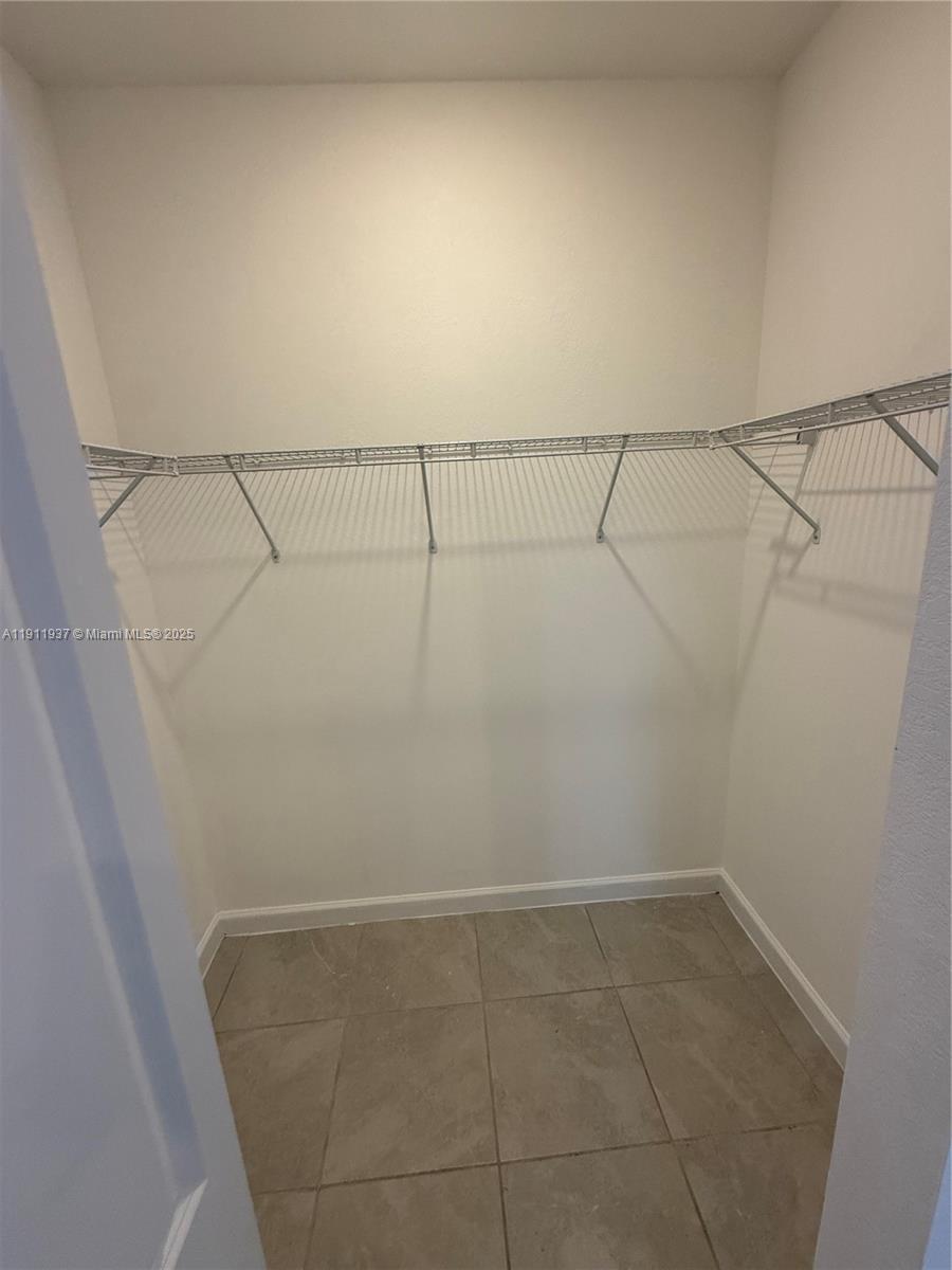 16910 Southwest 288th Street Homestead, FL 33030 - Photo 5 of 15 a view of a room with racks on the wall