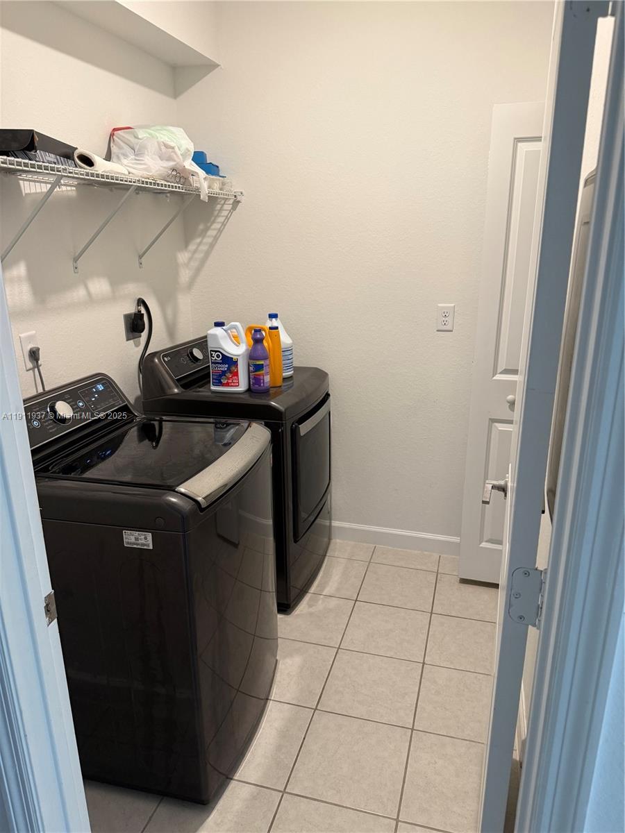 16910 Southwest 288th Street Homestead, FL 33030 - Photo 7 of 15 a utility room with dryer and washer