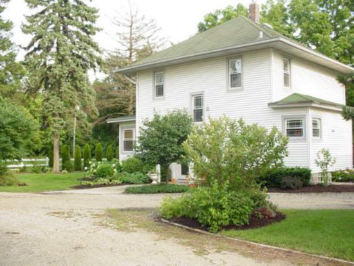 6N808 Dunham Road Wayne, IL 60184 - Photo 1 of 1 a white house that has a tree in front of it