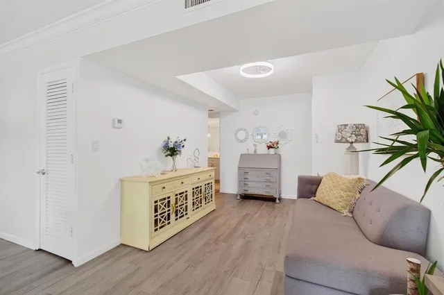 a spacious bedroom with a bed and a couch