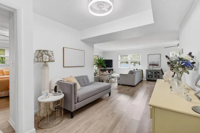 a living room with furniture and a large window