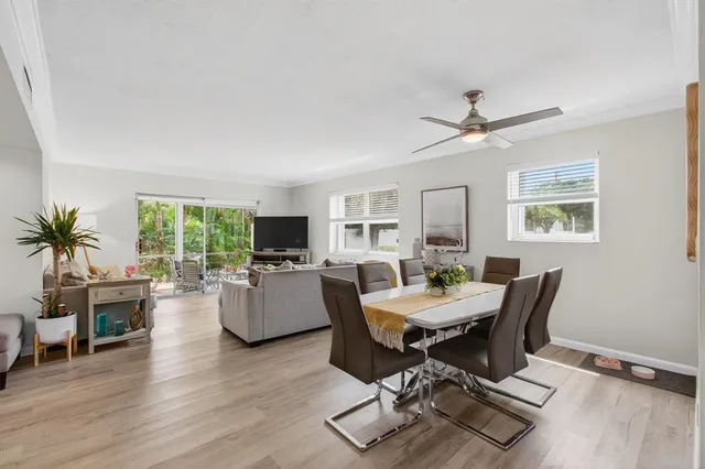 a view of a dining room with furniture window and wooden floor