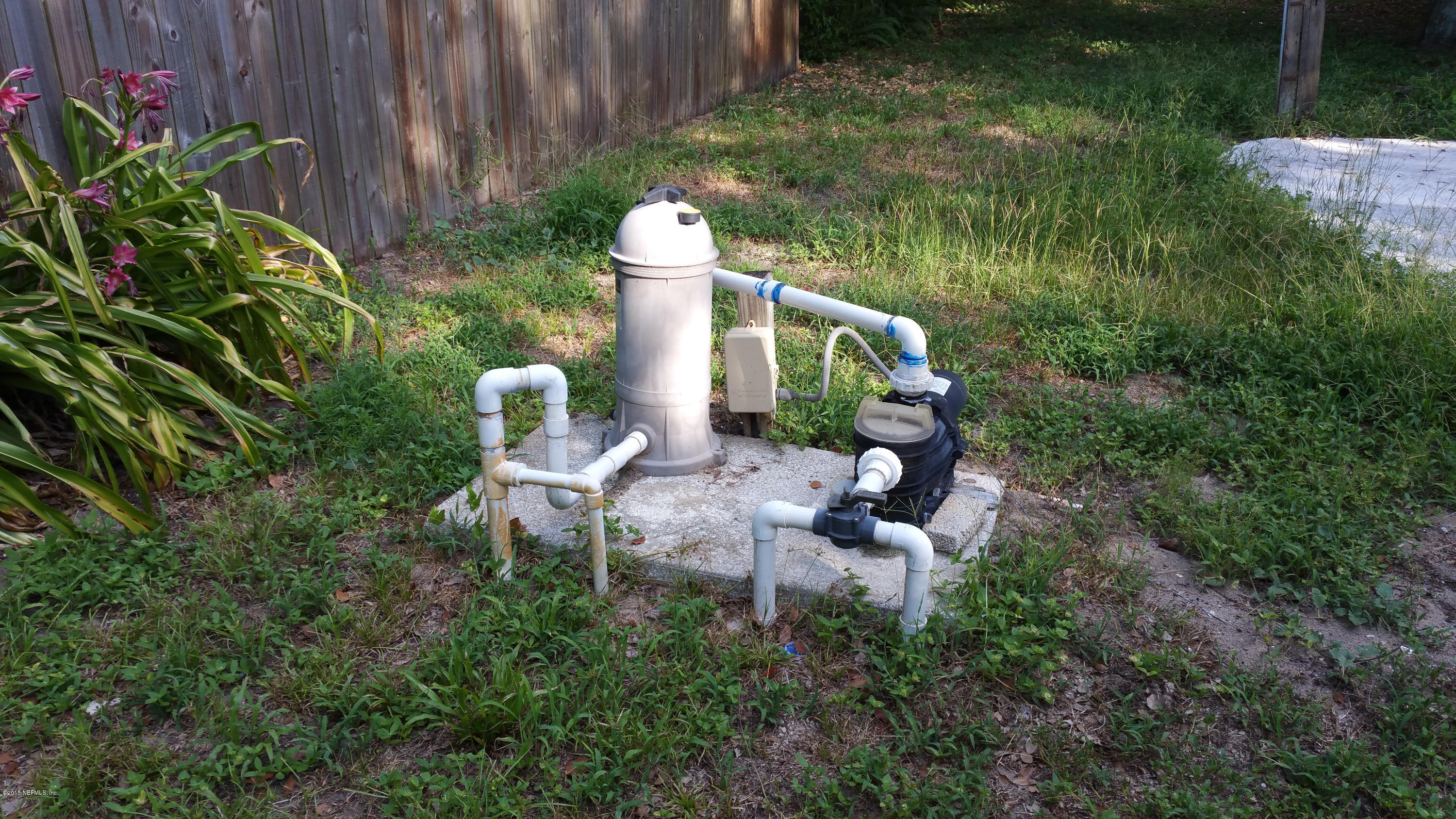 137 Argonaut Road St. Augustine, FL 32086 - Photo 12 of 14 a backyard of a house with lots of green space and lake view