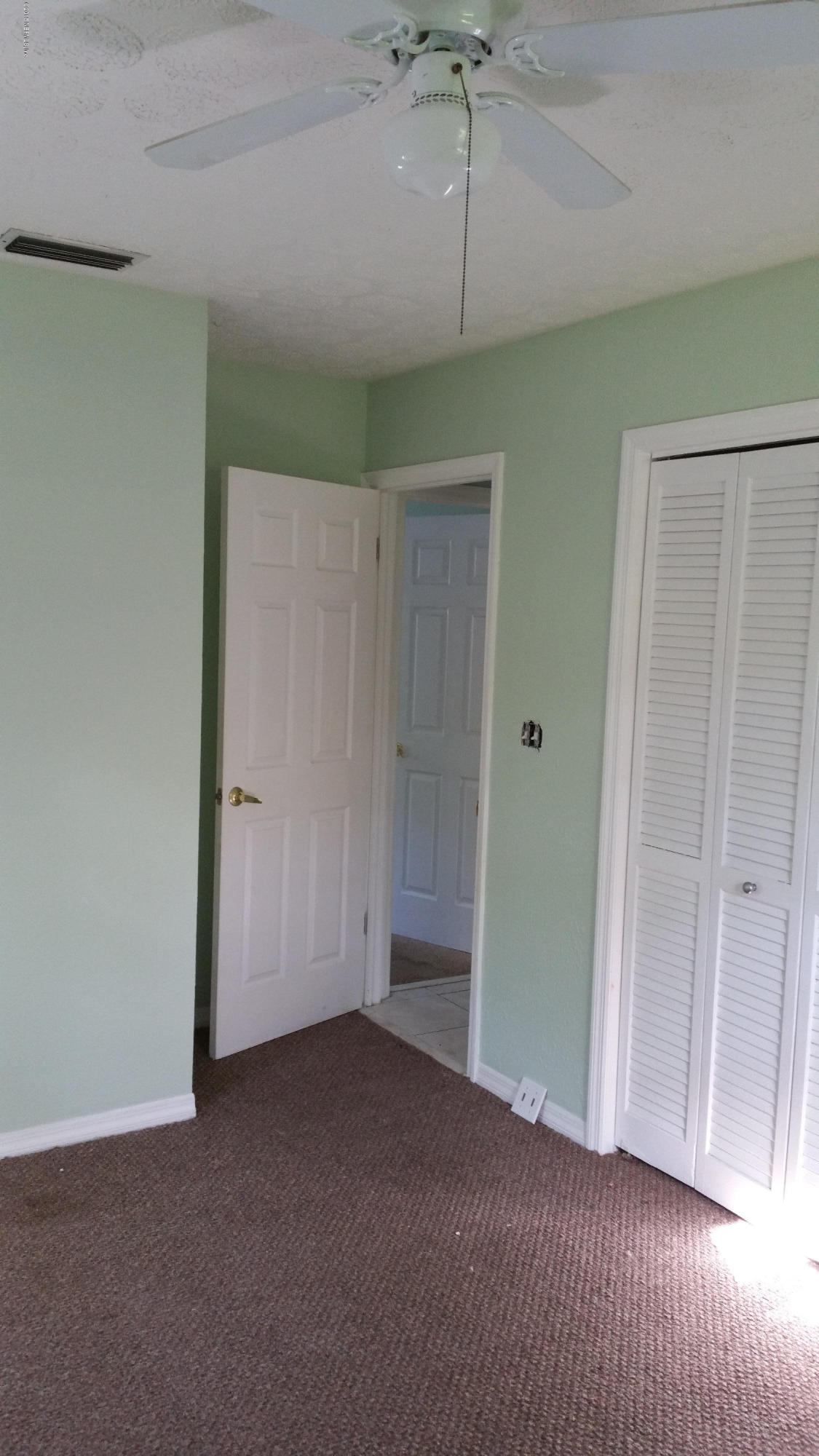 137 Argonaut Road St. Augustine, FL 32086 - Photo 4 of 14 a view of empty room with ceiling fan