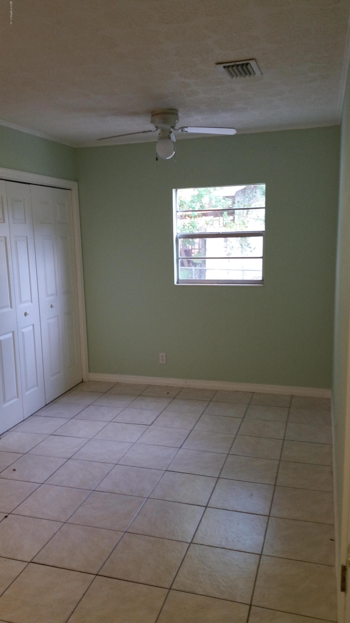 137 Argonaut Road St. Augustine, FL 32086 - Photo 8 of 14 a view of an empty room with a window