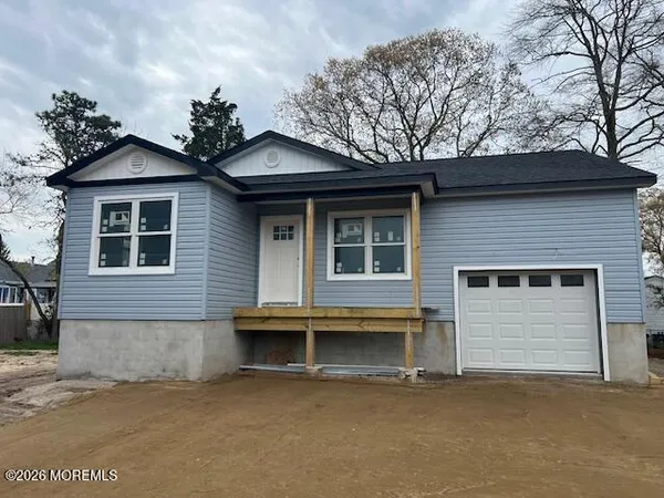 a front view of a house with a garage