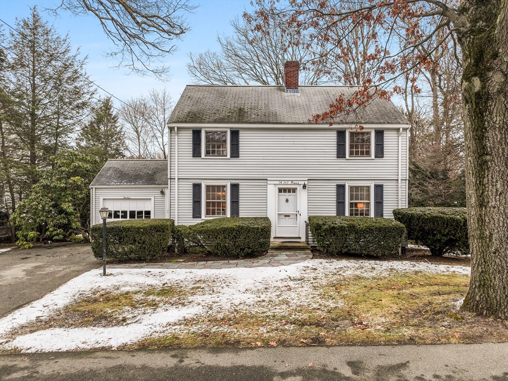 14 Ivy Road Wellesley, MA 02482 - Photo 1 of 22 a front view of a house with a yard covered in snow