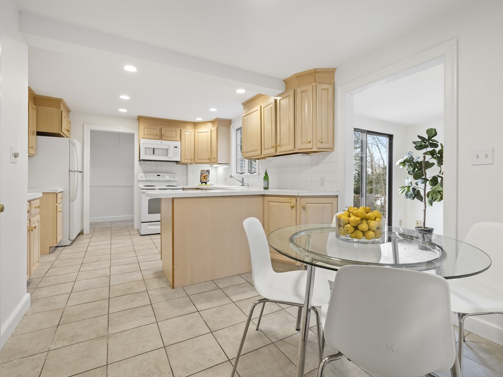 14 Ivy Road Wellesley, MA 02482 - Photo 11 of 22 a living room with stainless steel appliances furniture a dining table and kitchen view