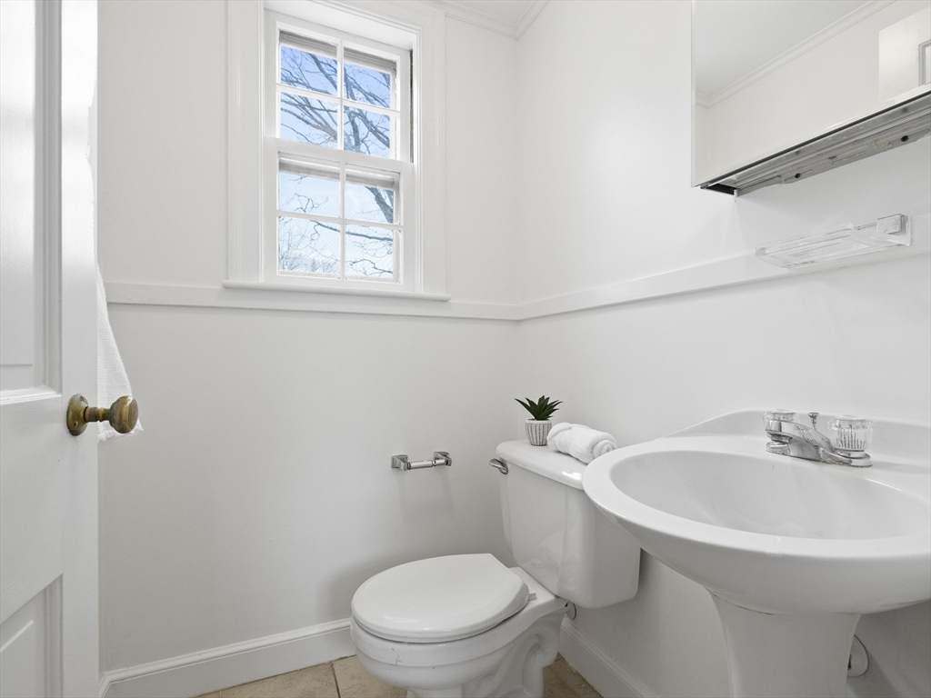 14 Ivy Road Wellesley, MA 02482 - Photo 12 of 22 a white toilet sitting next to a bathroom sink