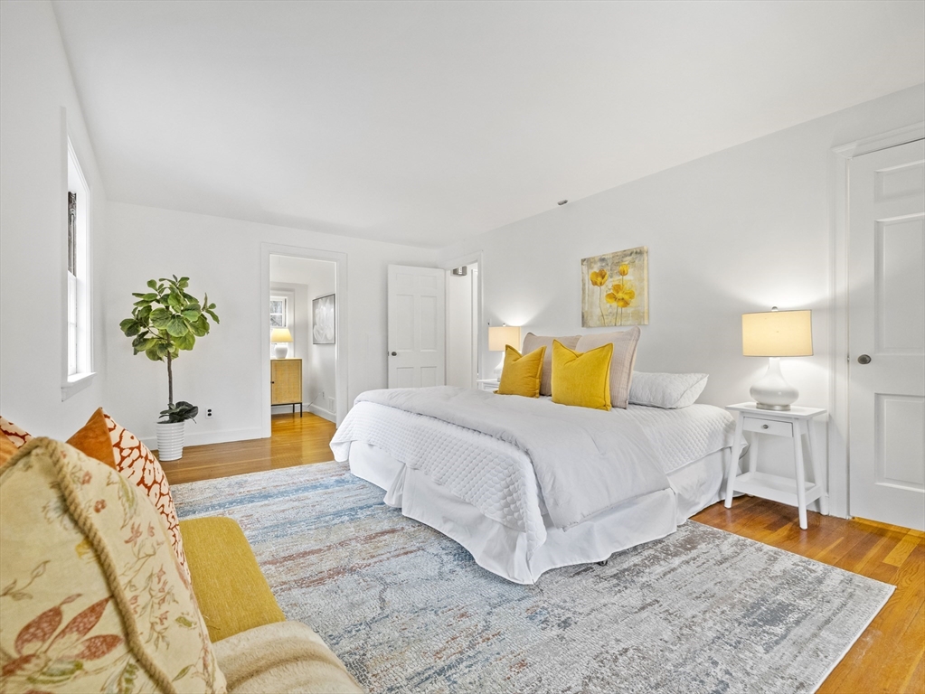 14 Ivy Road Wellesley, MA 02482 - Photo 13 of 22 a bedroom with a bed and wooden floor