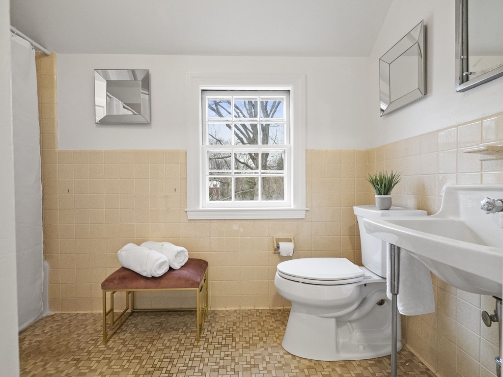14 Ivy Road Wellesley, MA 02482 - Photo 14 of 22 a bathroom with a toilet a sink and a window