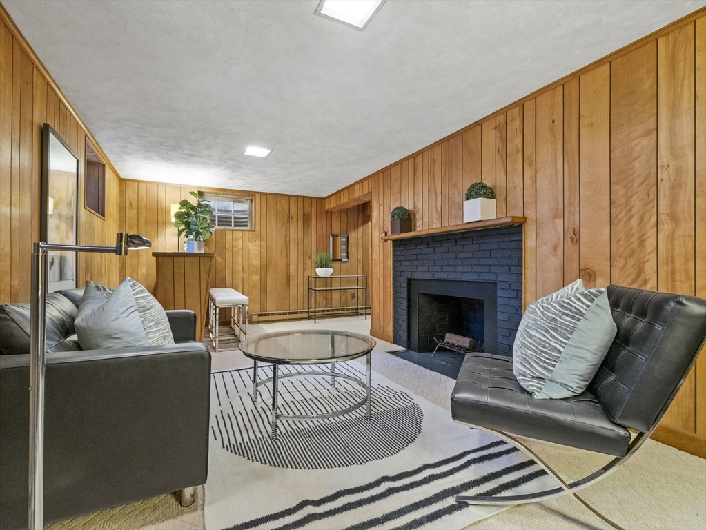 14 Ivy Road Wellesley, MA 02482 - Photo 18 of 22 a living room with furniture and a fireplace