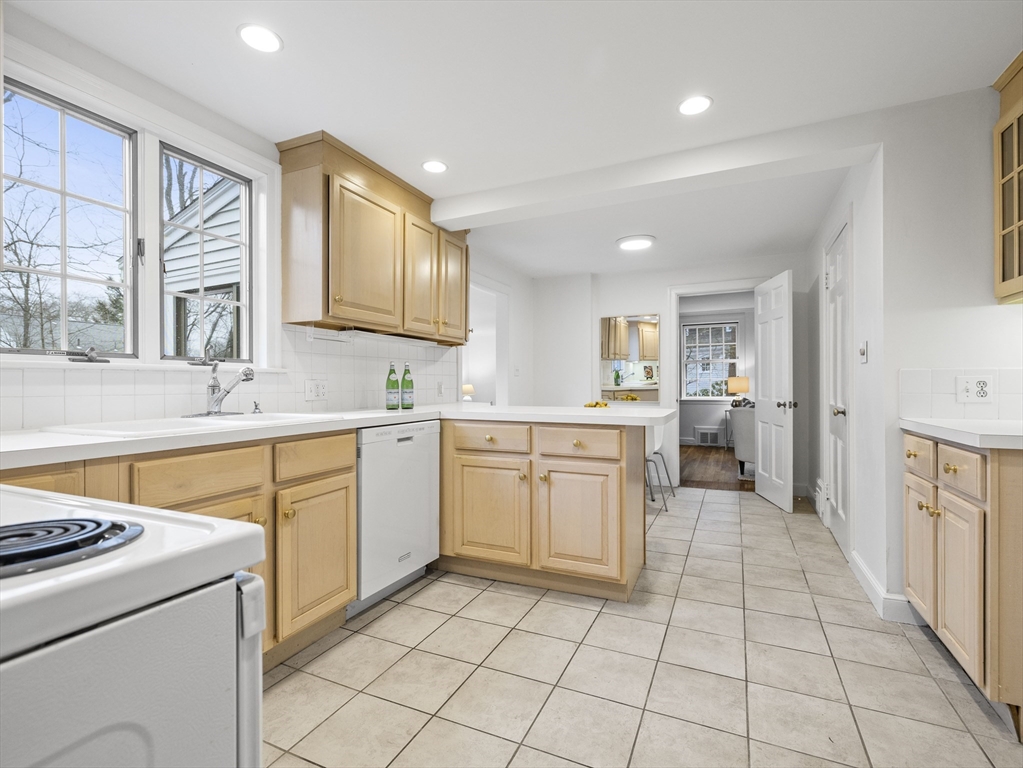 14 Ivy Road Wellesley, MA 02482 - Photo 10 of 22 a kitchen with a stove sink and cabinets