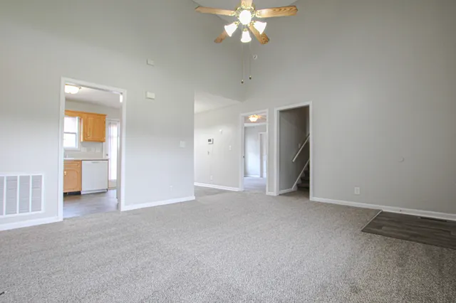 a view of an empty room with a bathroom
