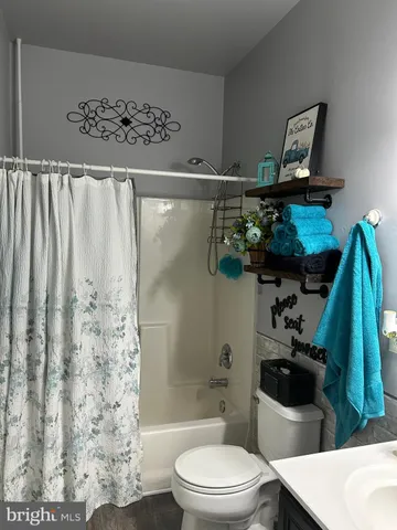 a bathroom with a bathtub and a sink