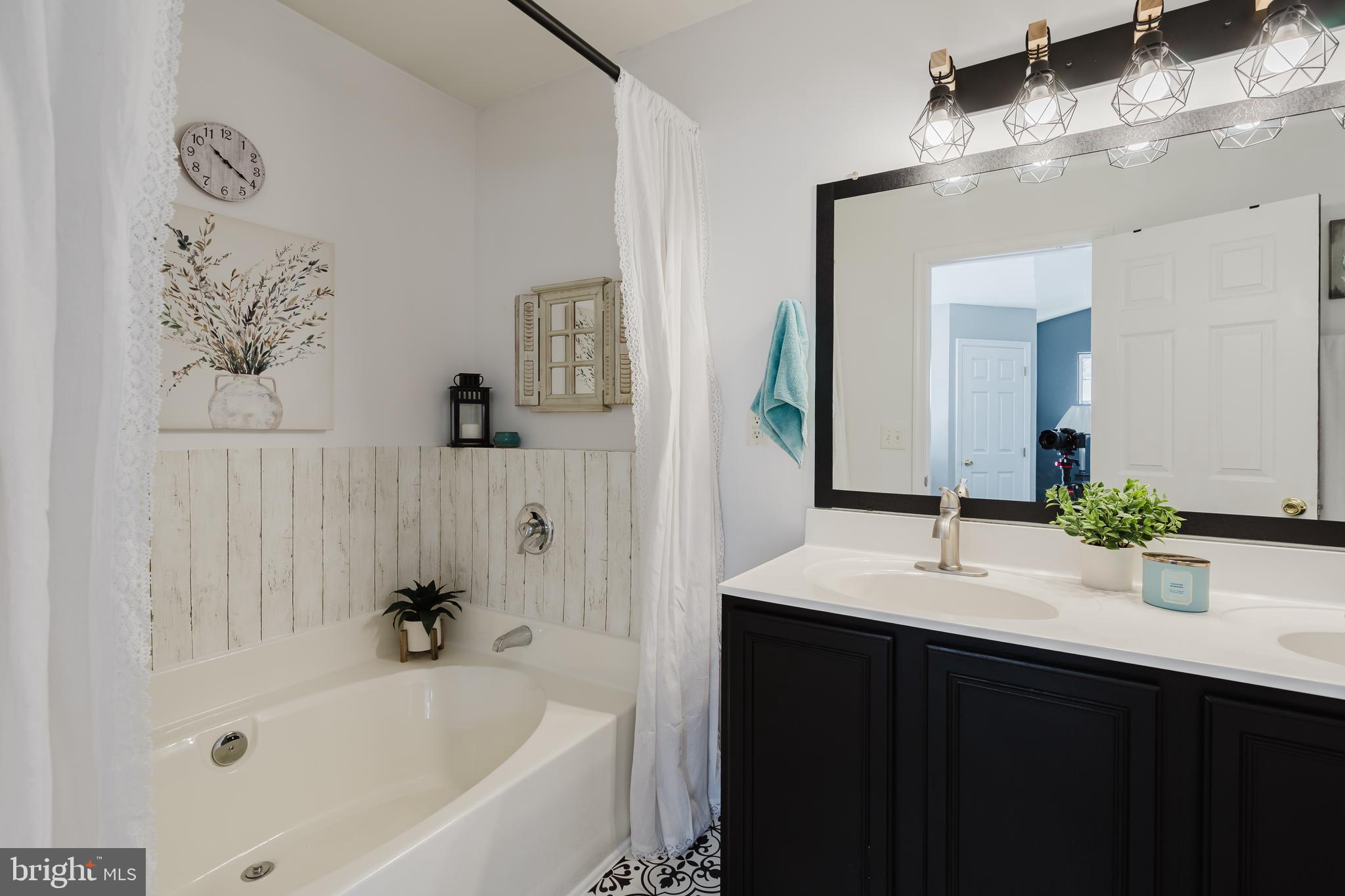 1 Bohemia Road Bear, DE 19701 - Photo 42 of 66 a bathroom with a bathtub and a sink