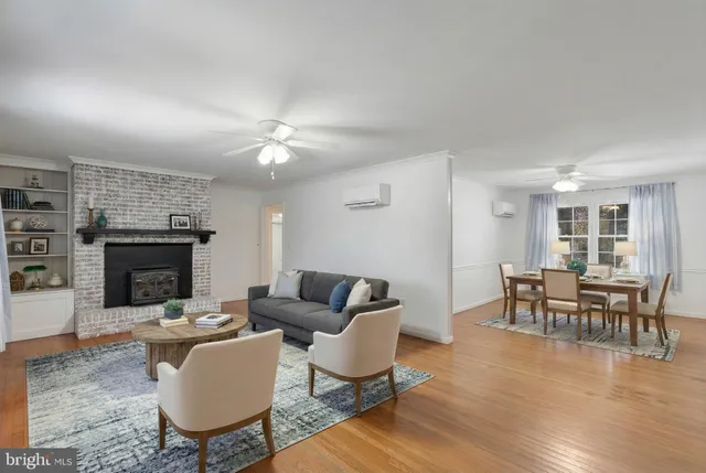 a living room with furniture and fireplace
