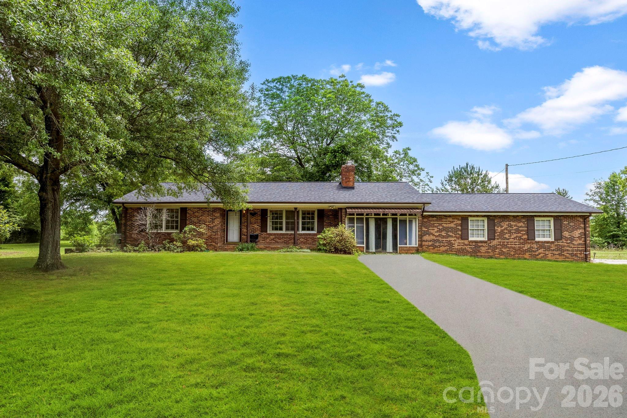 2829 Bettis Road Grover, NC 28073 - Photo 1 of 26 a front view of a house with a garden