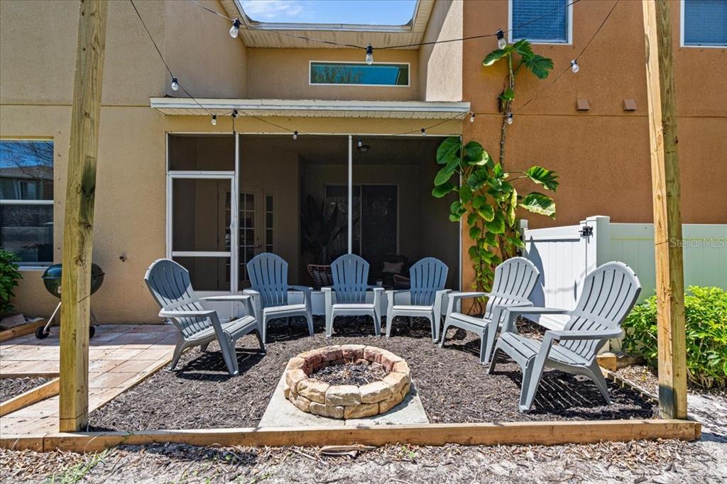 3271 Titanic Circle, Unit 39 Indialantic, FL 32903 - Photo 41 of 60 a view of a dinning table and chairs in the patio