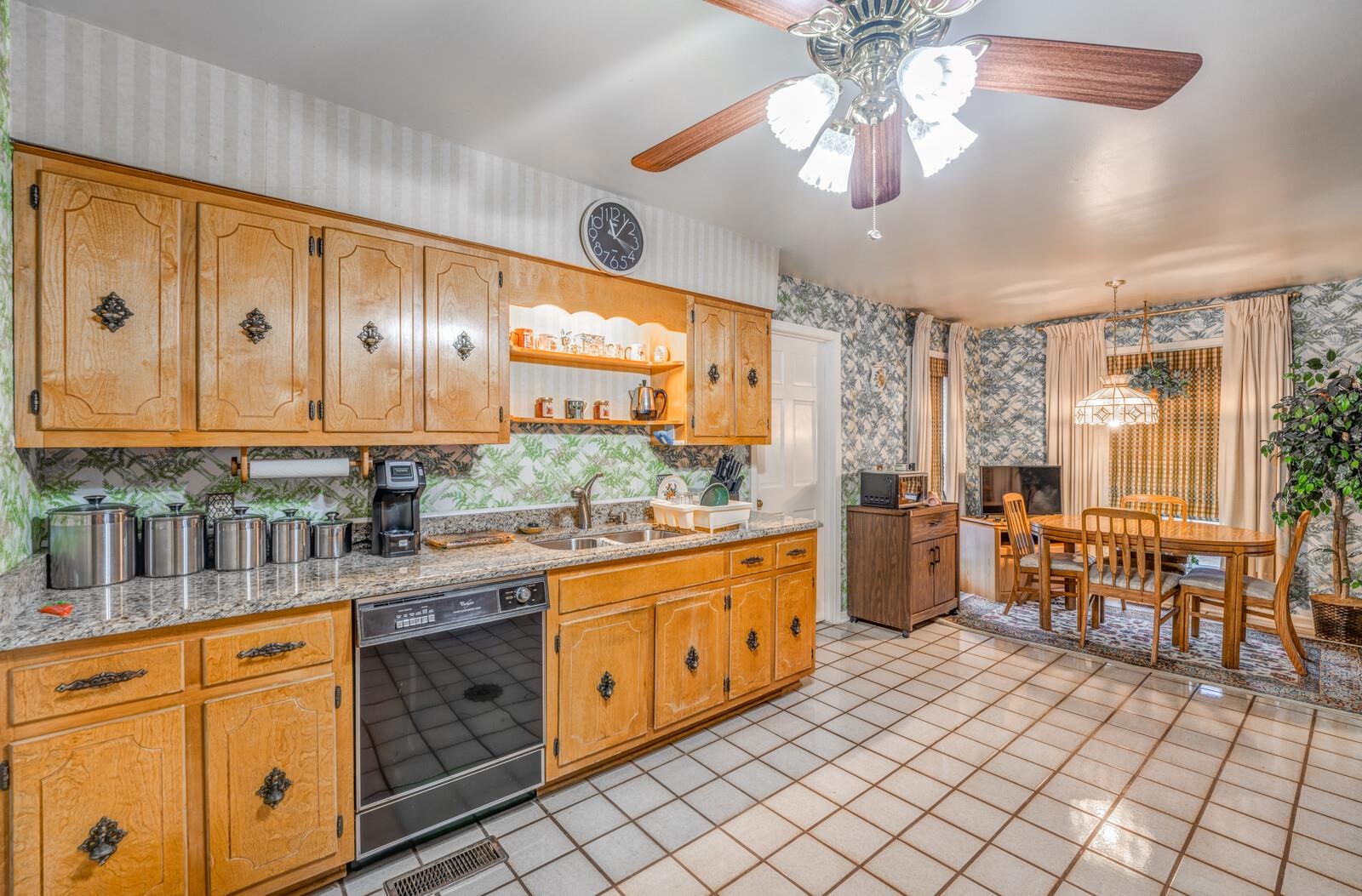 9715 Deadfall Road Brighton, TN 38011 - Photo 13 of 25 a kitchen with stainless steel appliances granite countertop a sink and cabinets