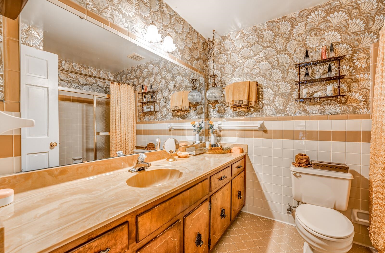 9715 Deadfall Road Brighton, TN 38011 - Photo 17 of 25 a bathroom with a granite countertop sink toilet and a mirror