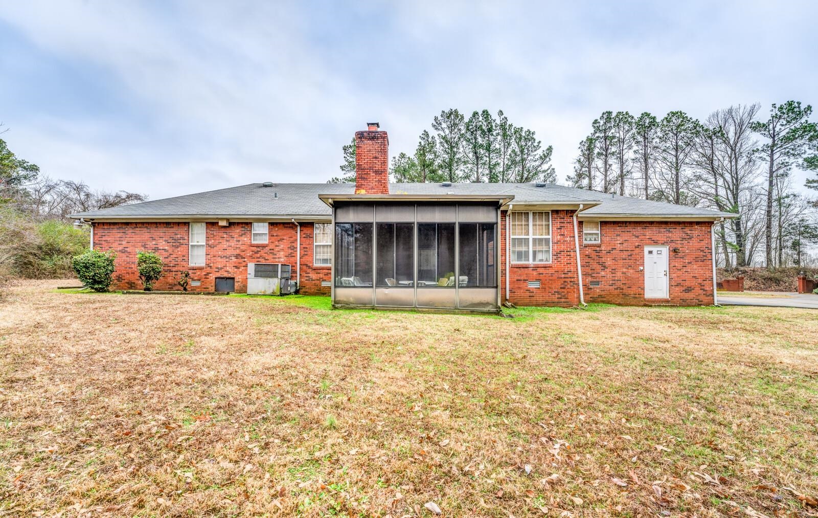 9715 Deadfall Road Brighton, TN 38011 - Photo 24 of 25 a front view of a house with a yard and garage