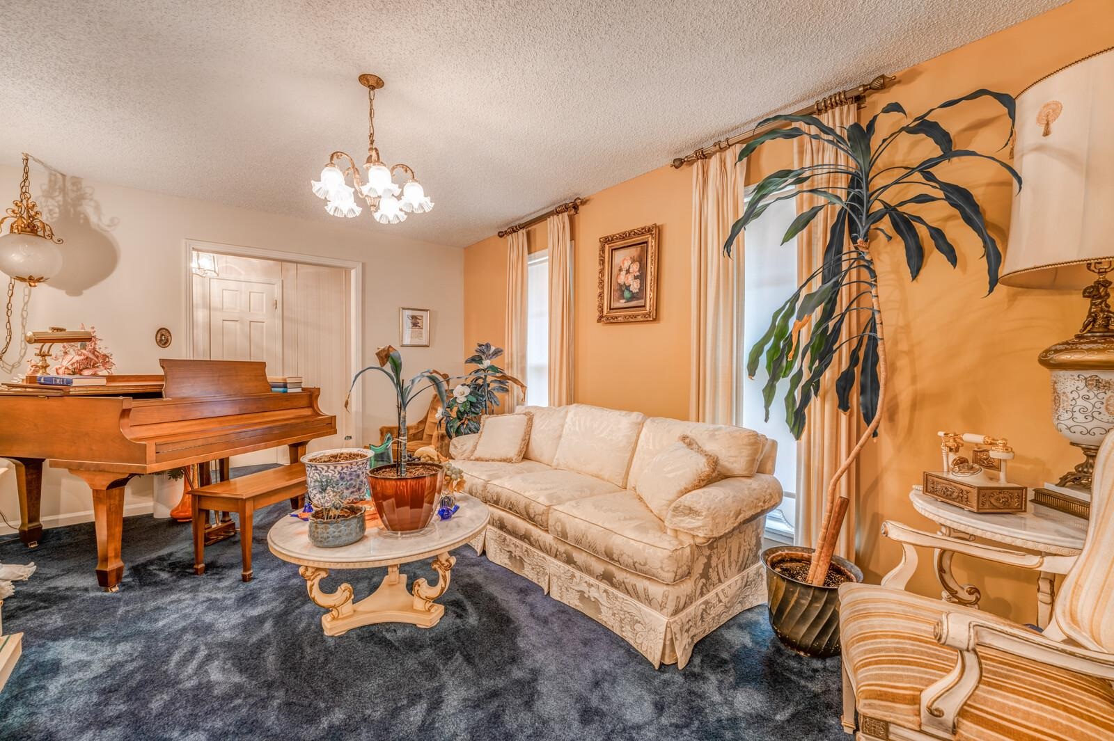 9715 Deadfall Road Brighton, TN 38011 - Photo 6 of 25 a living room with patio furniture and a chandelier