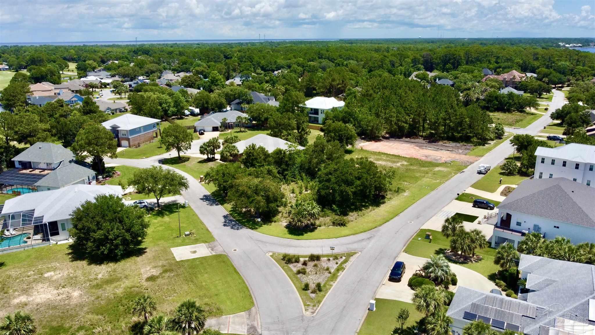 4136 Madura Road Gulf Breeze, FL 32563 - Photo 6 of 10 a view of a swimming pool with a garden