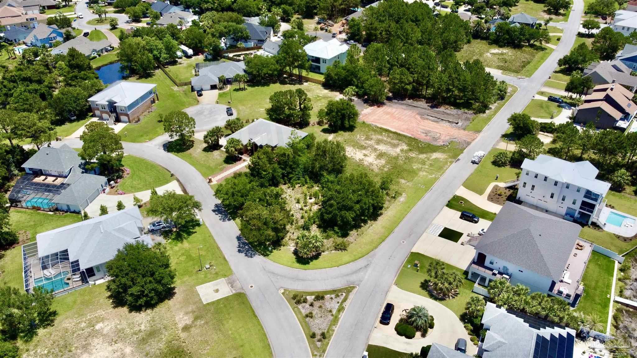 4136 Madura Road Gulf Breeze, FL 32563 - Photo 7 of 10 an aerial view of residential house with swimming pool and outdoor space
