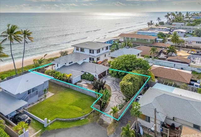 an aerial view of residential houses with outdoor space and swimming pool