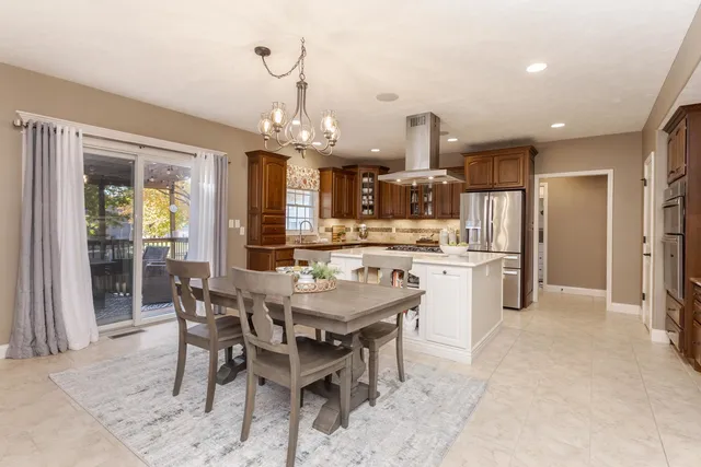 a kitchen with a table and chairs in it