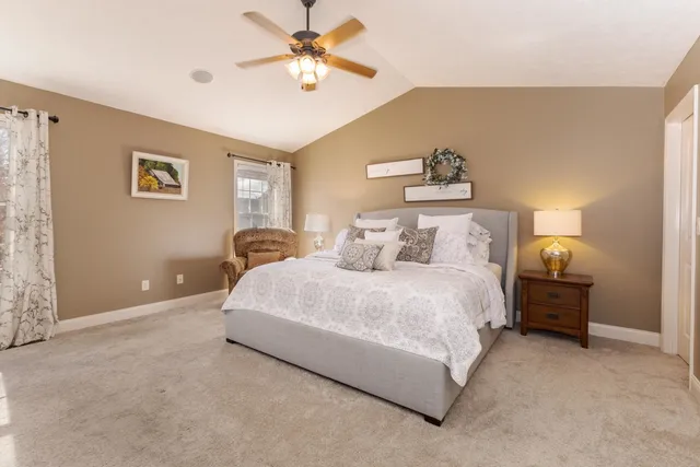 a bedroom with a bed and a television in it