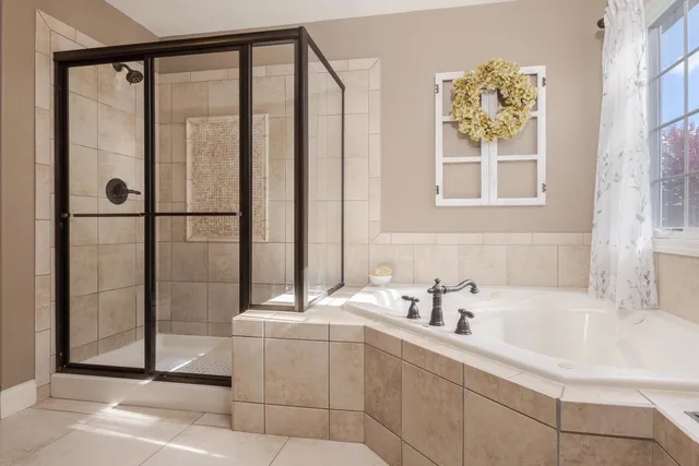 a bedroom with a large bed and a large window