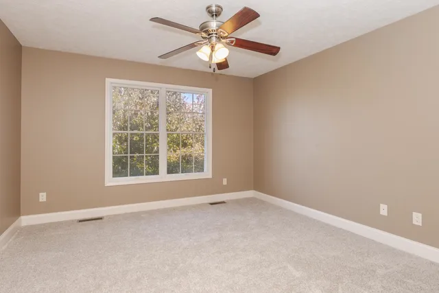 a view of entryway with wooden floor and window