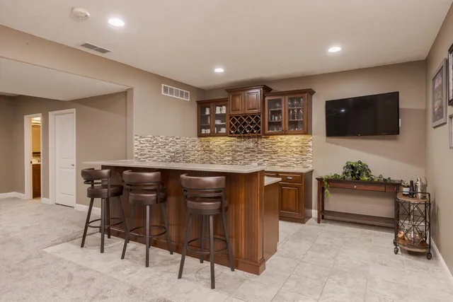 a kitchen that has a sink and a stove