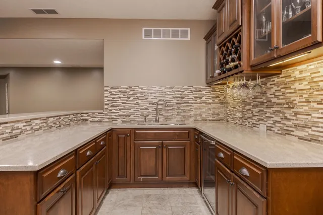 a kitchen with a sink and cabinets