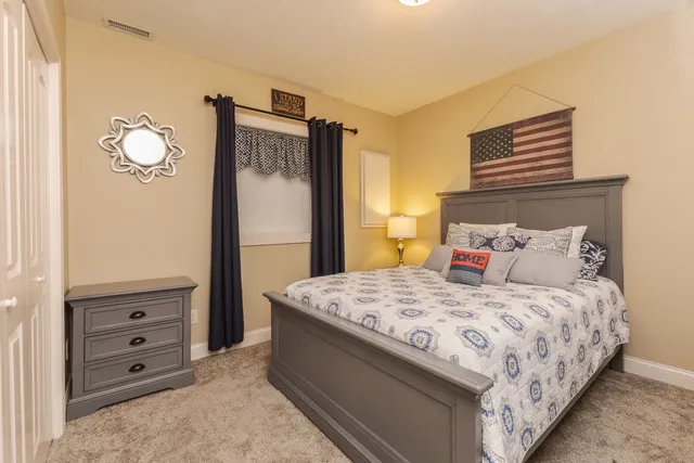 a view of a patio with table and chairs and potted plants