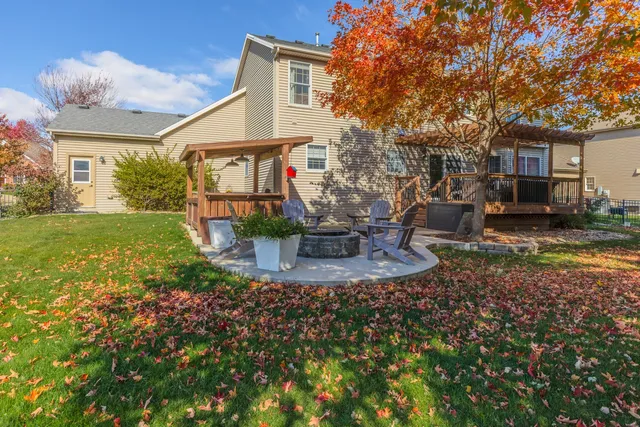 a view of a brick house with potted plants
